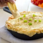 Your favorite pasta dish gets a makeover with this creamy Cajun Chicken Alfredo Dip with cream cheese, mozzarella, chicken and spice. Only five ingredients in this super cheesy dip with a creole kick!