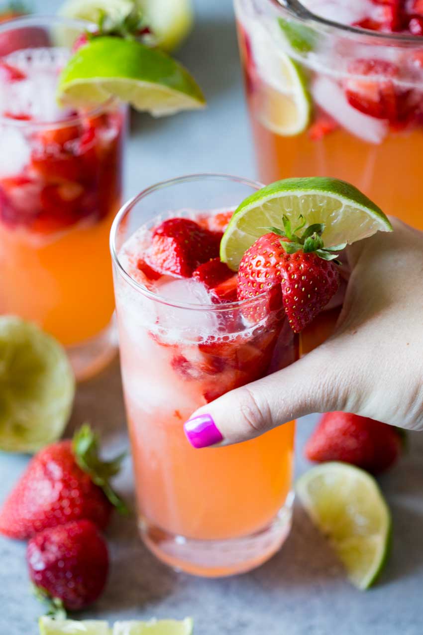 A glass of sparkling strawberry limeade. 