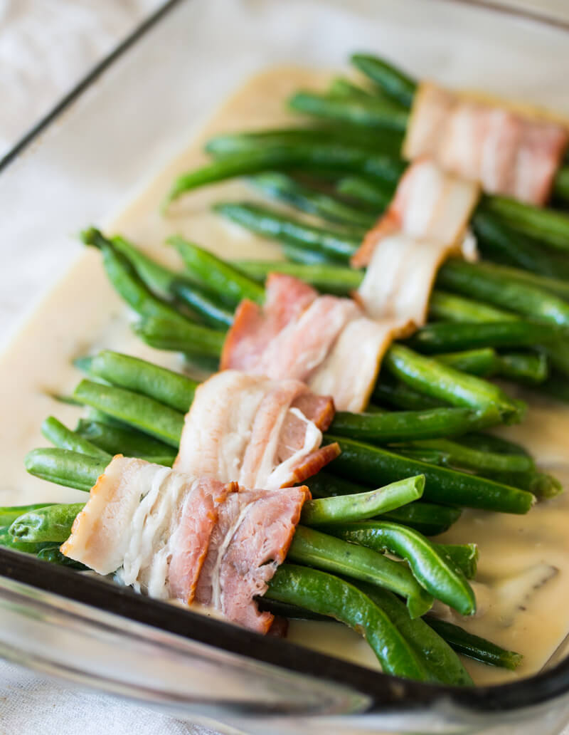Creamy Green Beans and Mushrooms: Features tender green beans that are wrapped in bacon and baked atop a creamy delicious mushroom sauce. Umm good!