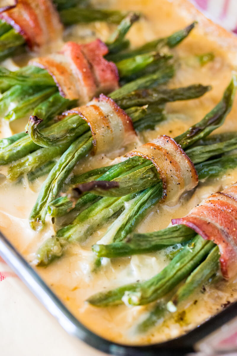 Green Beans and Cream of Mushroom: Features tender green beans that are wrapped in bacon and baked atop a creamy delicious mushroom sauce. Umm good!