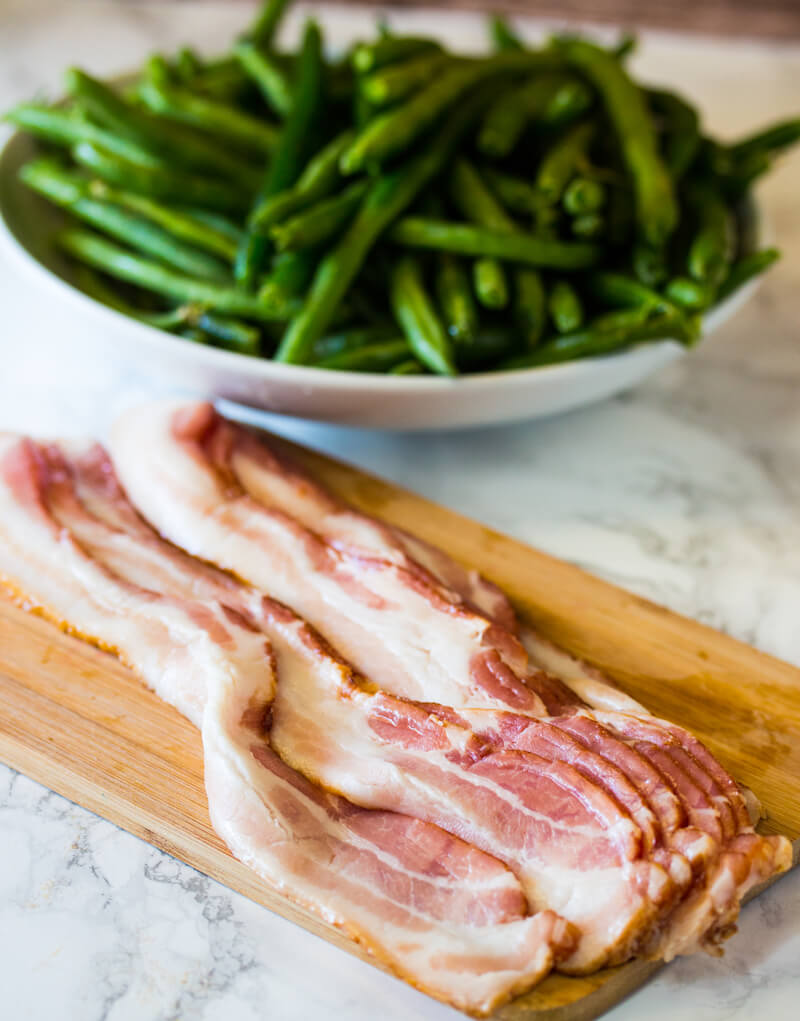 Green Beans Wrapped in Bacon: Features tender green beans that are wrapped in bacon and baked atop a creamy delicious mushroom sauce. Umm good!