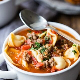 Beefy Tomato Tortellini Soup with sausage, and onion. the perfect comfort food soup