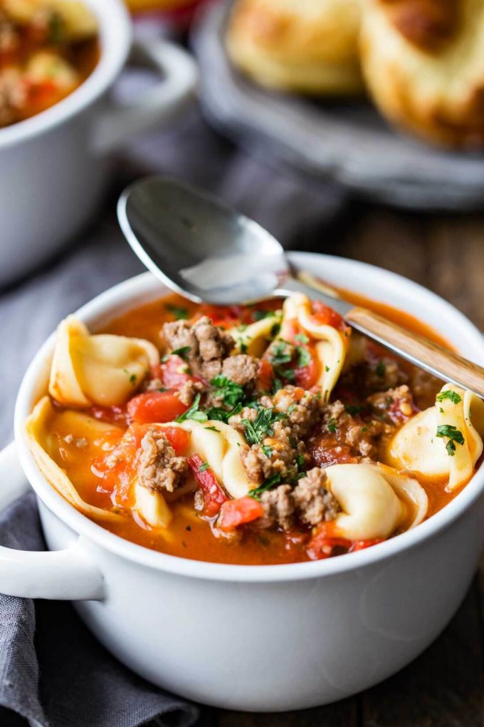 Beefy Tomato Tortellini Soup with sausage, and onion. the perfect comfort food soup