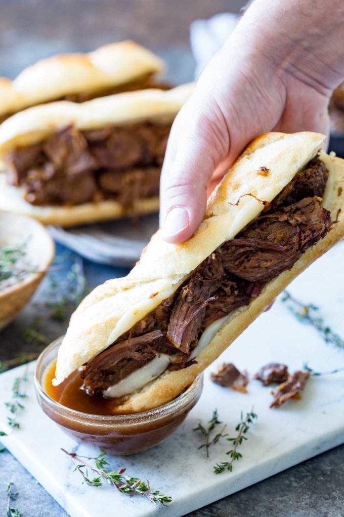 Easy Slow Cooker French Dip Sandwiches: Best French Dip ever!! Delectable, tender, and flavorful beef, wrapped in melted cheese in a French Demi Baguette.