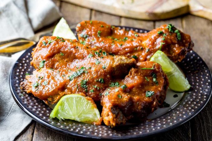 Delicious ribs cooked in slow cooker and smothered in pineapple chipotle sauce
