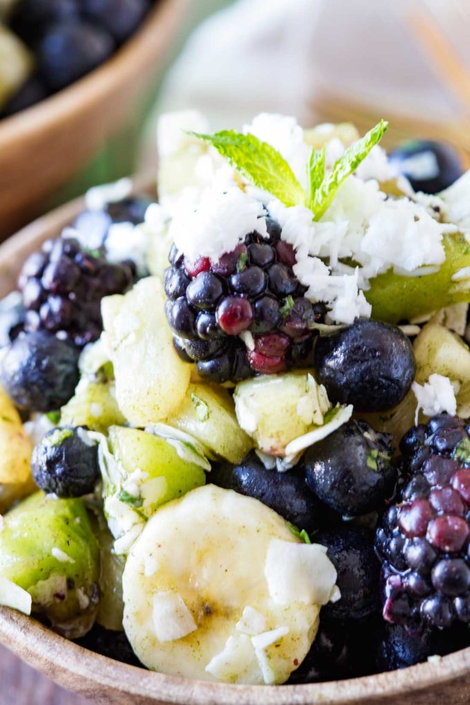 A pina colada fruit salad with beauty greens