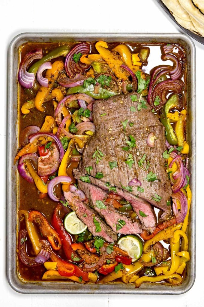 Sheet pan flank steak fajitas are packed with flavor and the perfect meal. My husband said this was his favorite thing I have ever made.