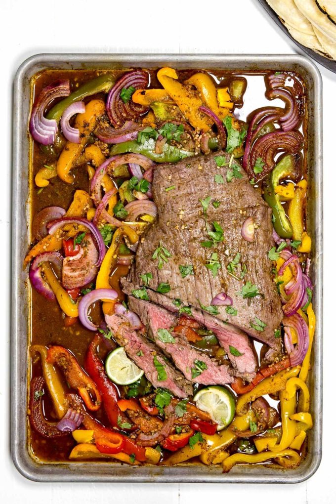 Sheet pan flank steak fajitas are packed with flavor and the perfect meal. My husband said this was his favorite thing I have ever made. 