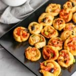 These Supreme Pizza Pinwheels are the perfect appetizer to please the whole crowd!