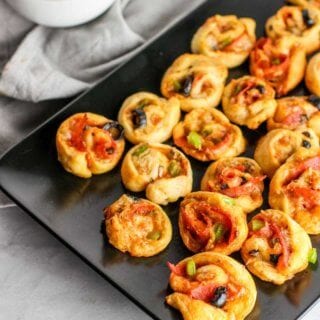 These Supreme Pizza Pinwheels are the perfect appetizer to please the whole crowd!