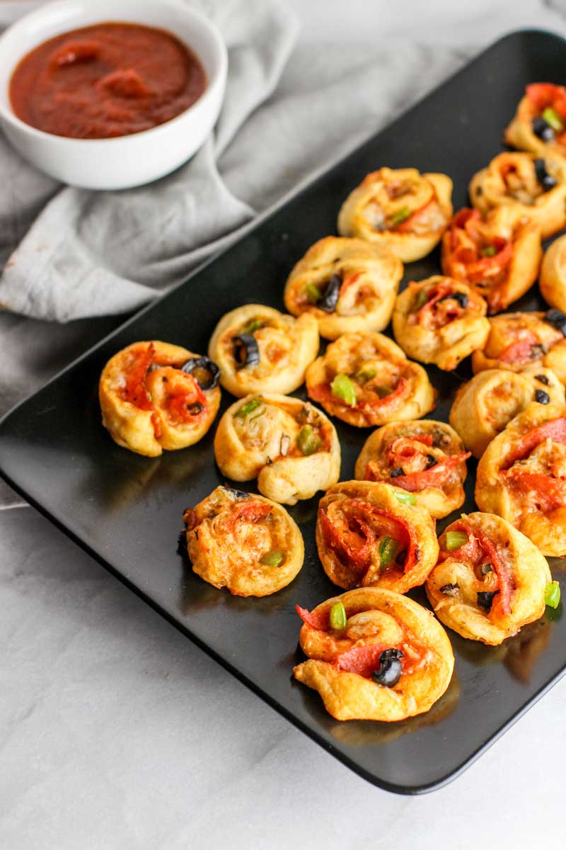 These Supreme Pizza Pinwheels are the perfect appetizer to please the whole crowd!
