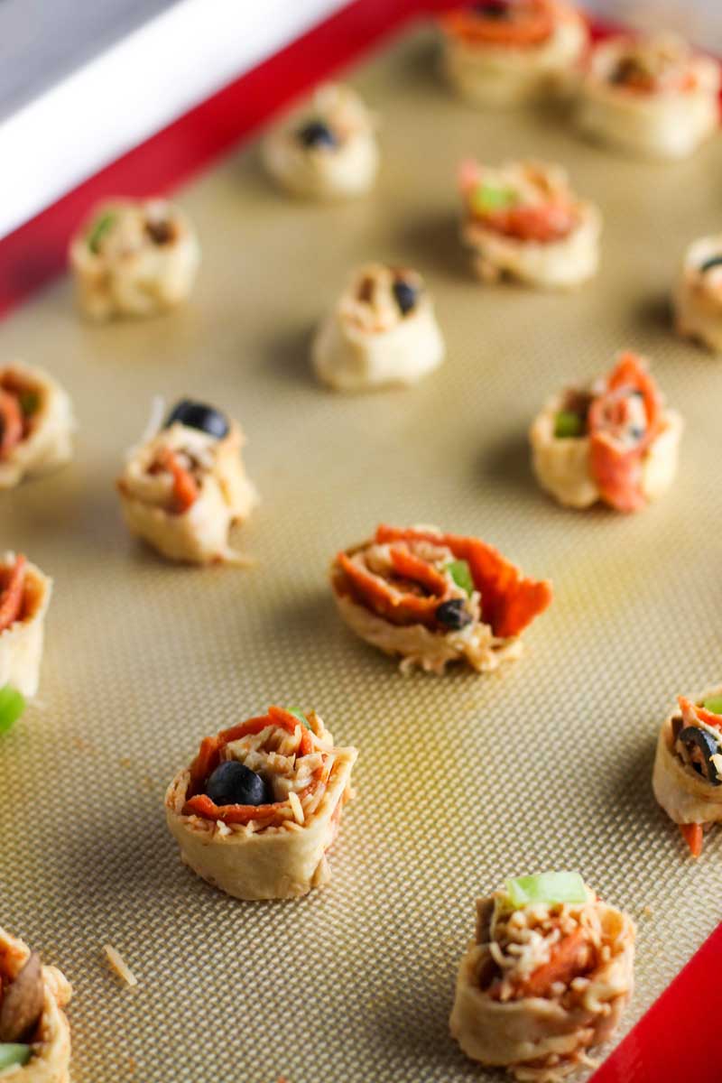 These Supreme Pizza Pinwheels are the perfect appetizer to please the whole crowd!