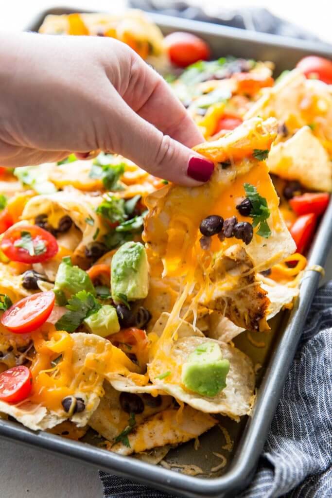 Chicken for Nachos: These nachos are ultra filling, easy to make, and are loaded with crunchy chips, melty cheese, flavorful chicken, and your favorite toppings! 