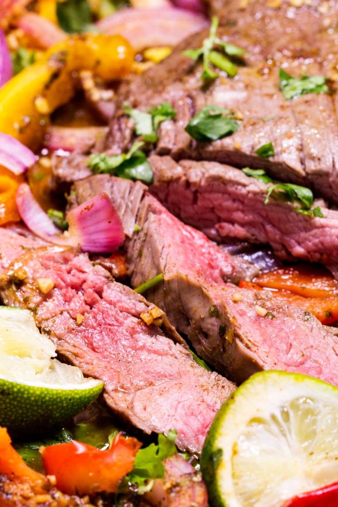 Tender flavorful beef and fajita fixings, this is a one sheet pan meal that is killer!