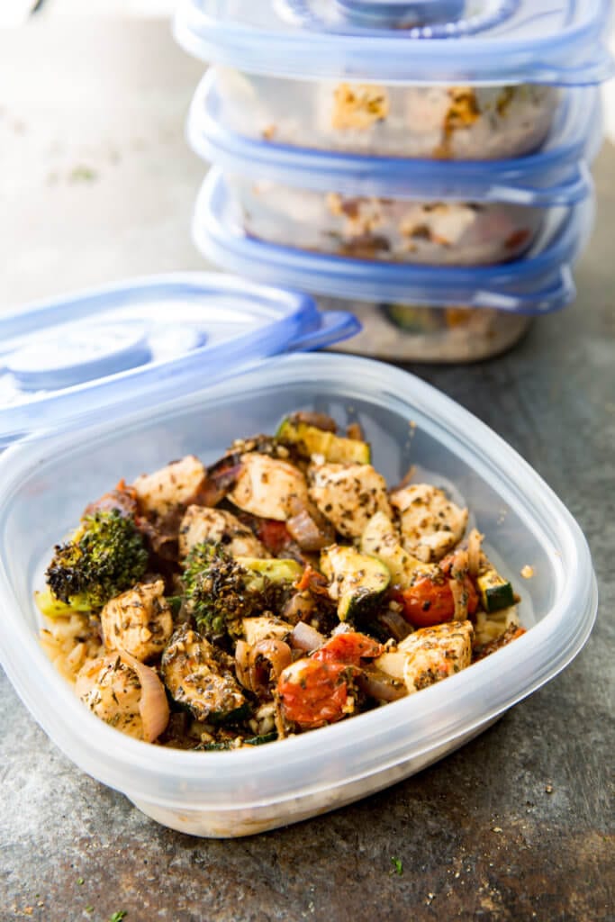 Chicken Meal Prep Ideas: Brown rice, zucchini, broccoli, tomatoes, onion and seasoned chicken, all cooked on a sheet pan for big flavor, meal prep!