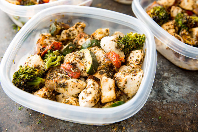 Chicken Meal Prep: Brown rice, zucchini, broccoli, tomatoes, onion and seasoned chicken, all cooked on a sheet pan for big flavor, meal prep!