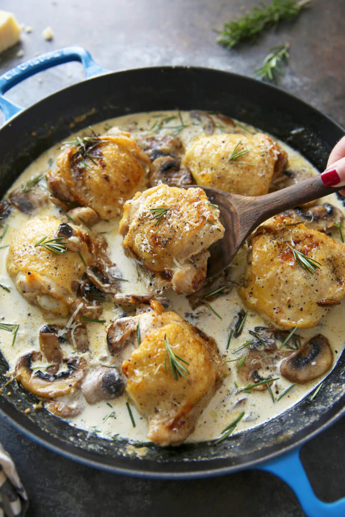 Rosemary Mushrooms and creamy sauce over a chicken thigh