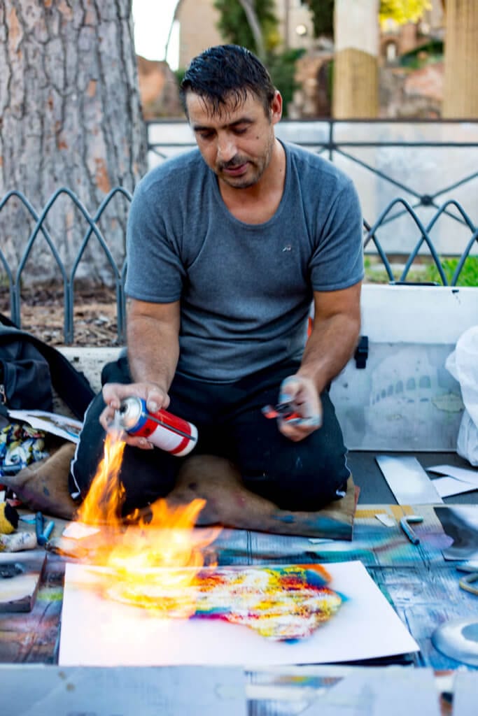 Rome street artists making photos with spray paint