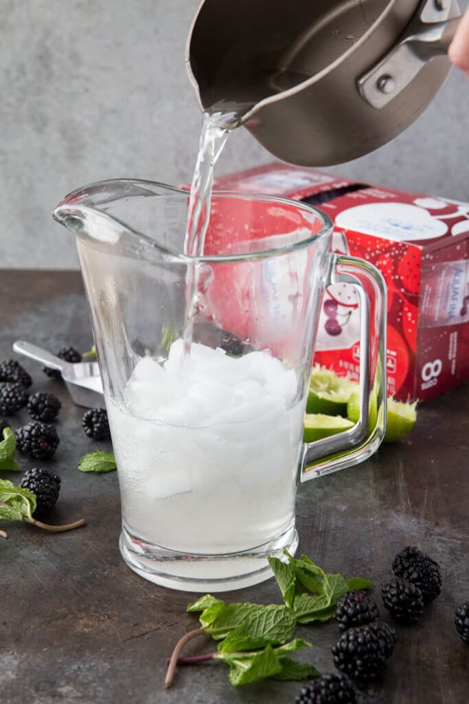 Pouring simple syrup into pitcher