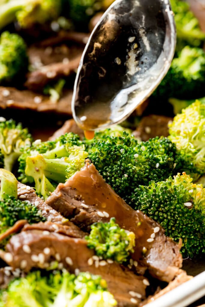 Spooning sauce over beef and broccoli