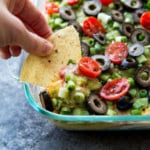 Classic 7 layer cheese dip with a twist. This upgraded 7 layer dip is amazing