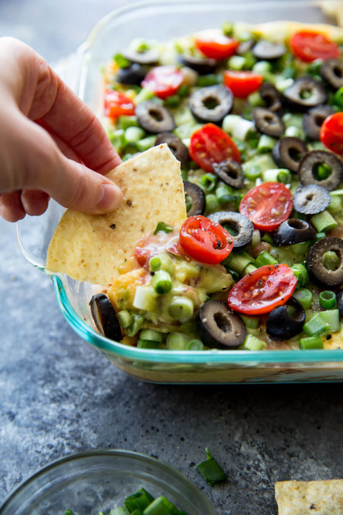 Classic 7 layer cheese dip with a twist. This upgraded 7 layer dip is amazing
