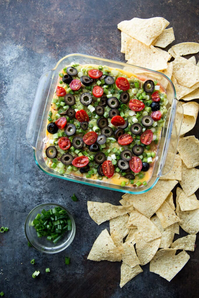 Classic 7 Layer dip just got an upgrade with pourable cheese