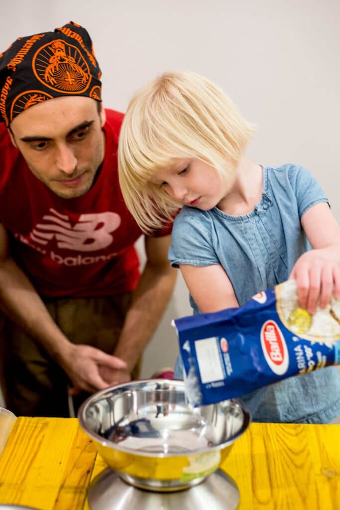 CC making PASTA in ROME measuring flour