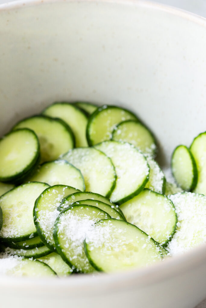 Salt and drain cucumbers