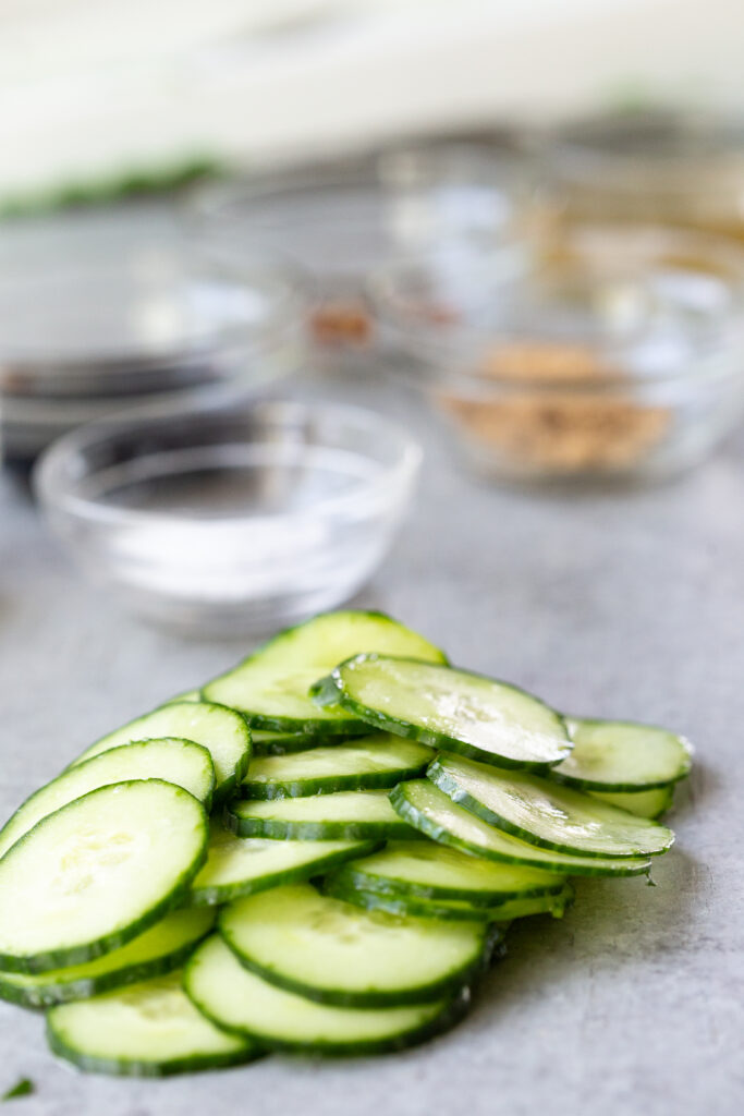 Slicing cucumbers into thin, even, slices. 