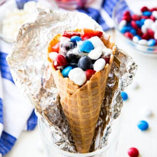 Campfire cones, waffle cones filled with marshmallows, fruit, and chocolate, and cooked in a campfire or oven.