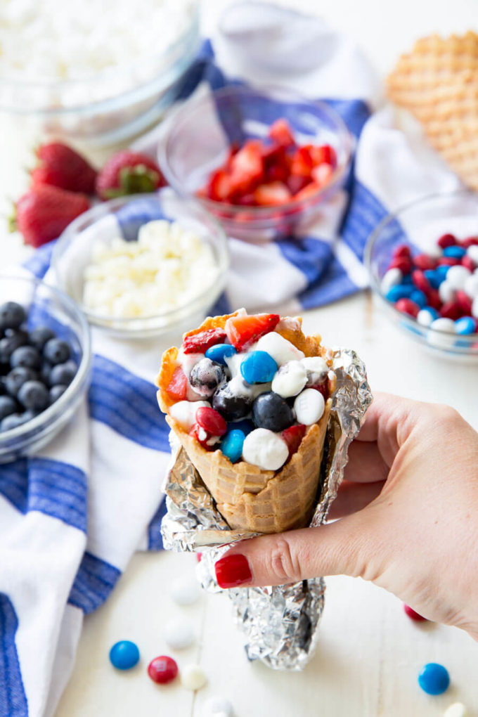 Campfire cones, waffle cones filled with marshmallows, fruit, and chocolate, and cooked in a campfire or oven. 