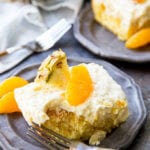 Mandarin Orange Cake with Pineapple fluff frosting or pig pickin' cake is delicious yellow cake with fruity highlights