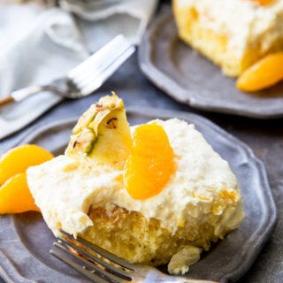 Mandarin Orange Cake with Pineapple fluff frosting or pig pickin' cake is delicious yellow cake with fruity highlights