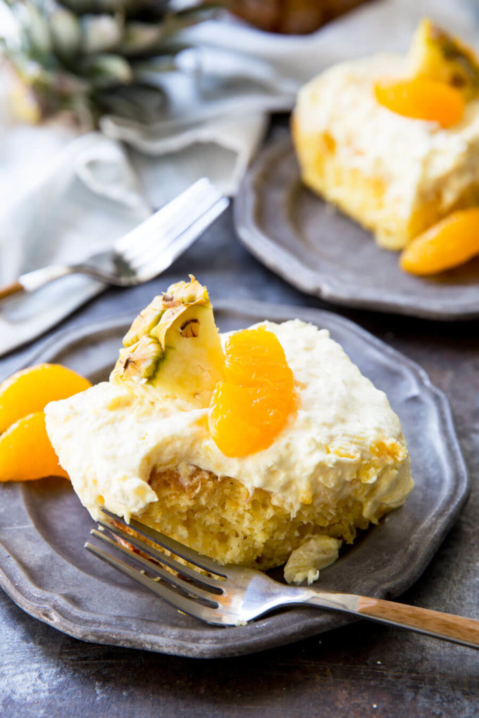 Mandarin Orange Cake with Pineapple fluff frosting or pig pickin' cake is delicious yellow cake with fruity highlights