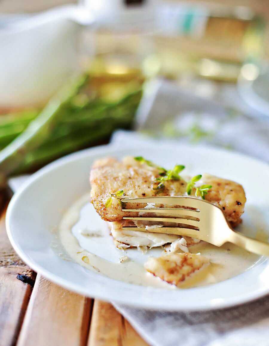 Haddock recipe with white wine sauce: Flaky haddock pan fried, and served with a browned butter white wine sauce. Amazingly flaky fish, with a gourmet flavor, prepared in 20 minutes or less. This simple but elegant meal is sure to be a hit!