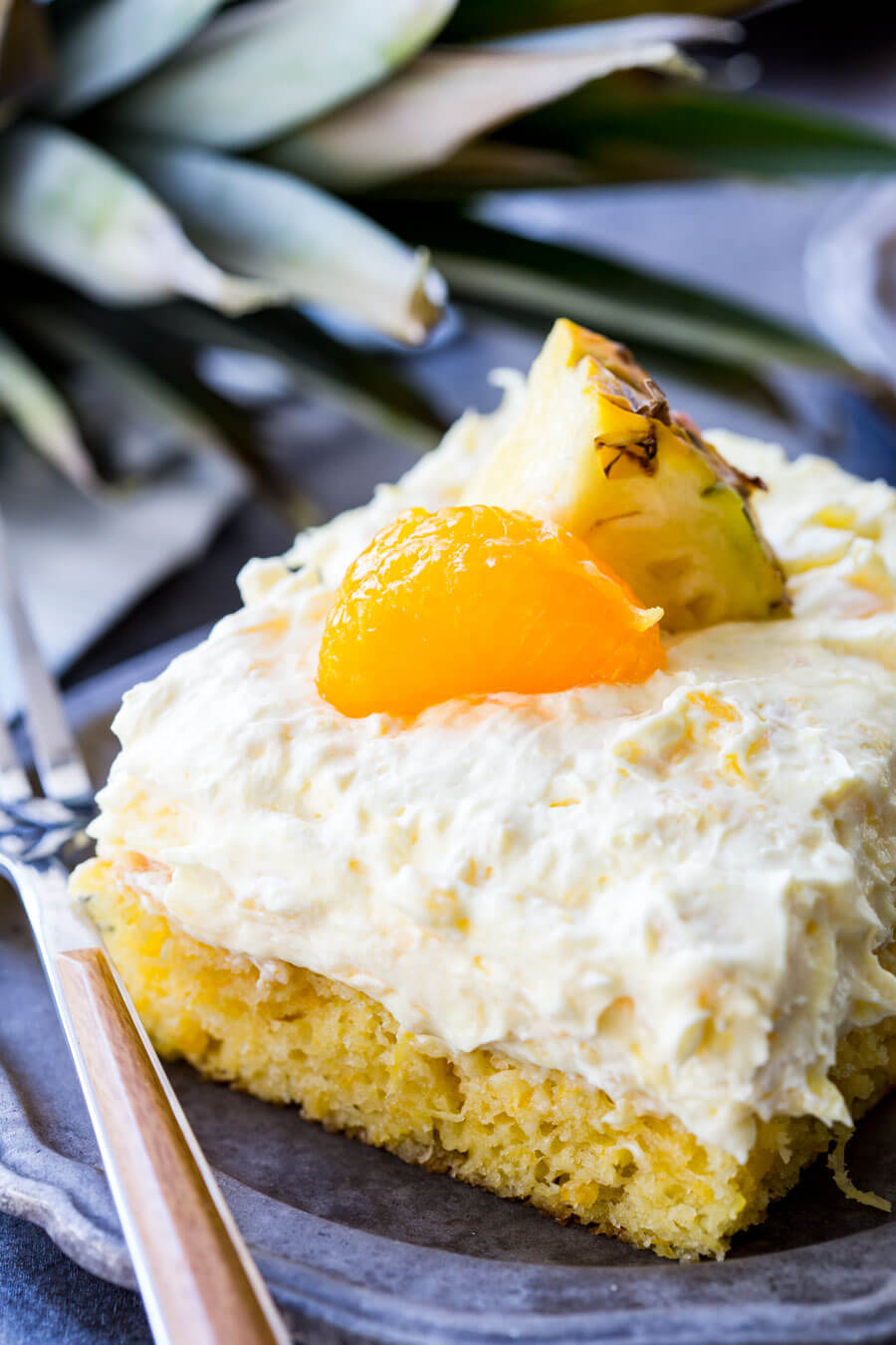 Mandarin Orange Cake with Pineapple fluff frosting or pig pickin' cake is delicious yellow cake with fruity highlights