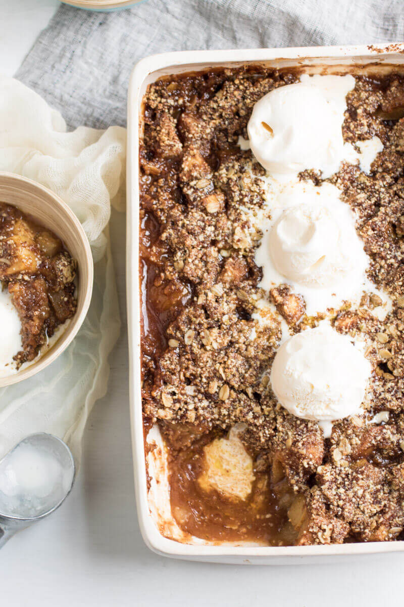 Insanely Delicious Apple Pear Crisp with an oat, almond, and pumpkin seed topping. Gluten free and yummy!