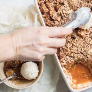 Insanely Delicious Apple Pear Crisp with an oat, almond, and pumpkin seed topping. Gluten free and yummy!