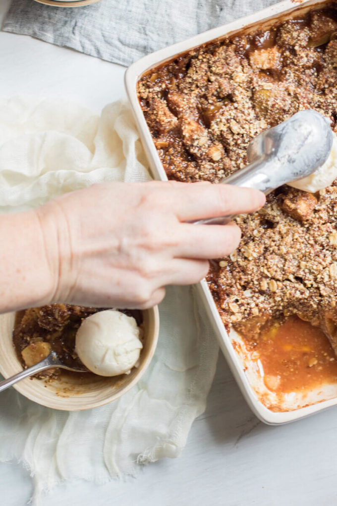 Insanely Delicious Apple Pear Crisp with an oat, almond, and pumpkin seed topping. Gluten free and yummy!