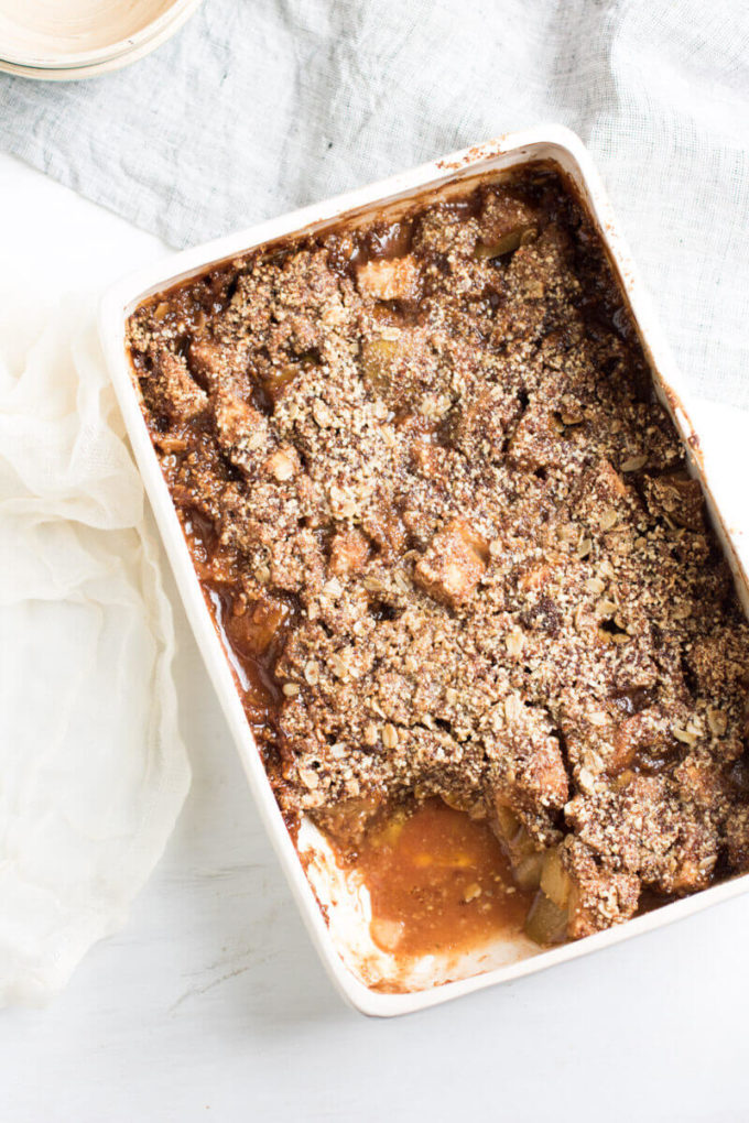 Insanely Delicious Apple Pear Crisp with an oat, almond, and pumpkin seed topping. Gluten free and yummy!