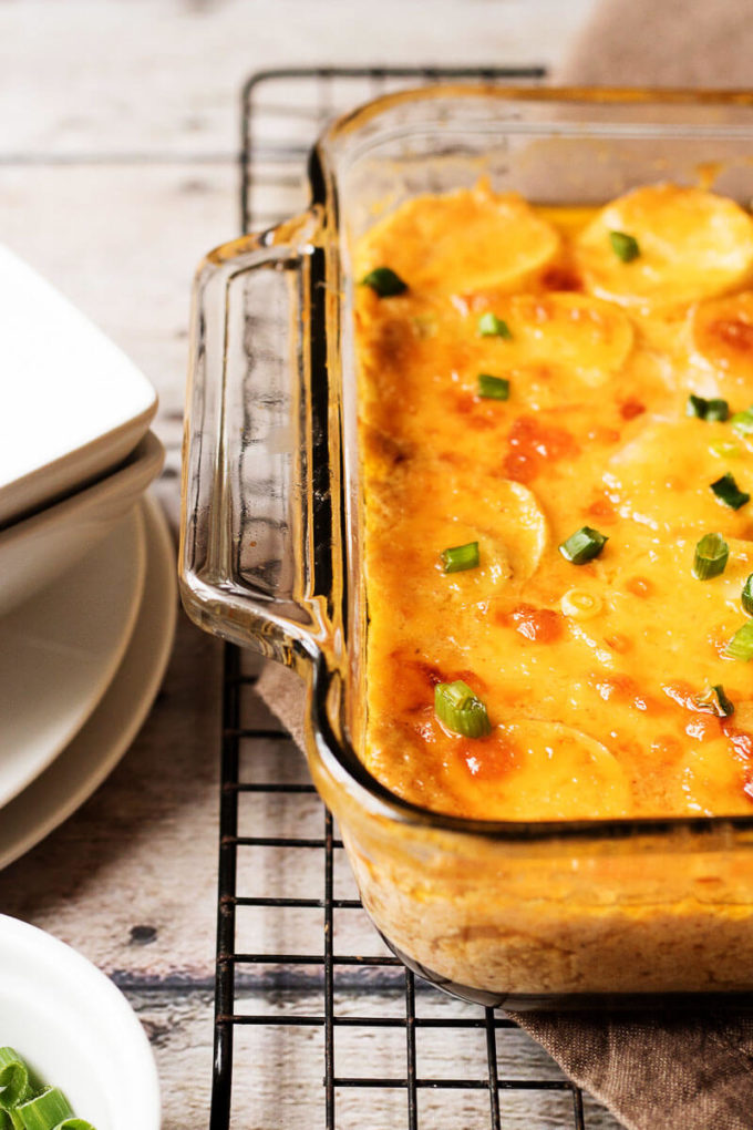 Easy Cheesy Scalloped Potatoes topped with Green Onions