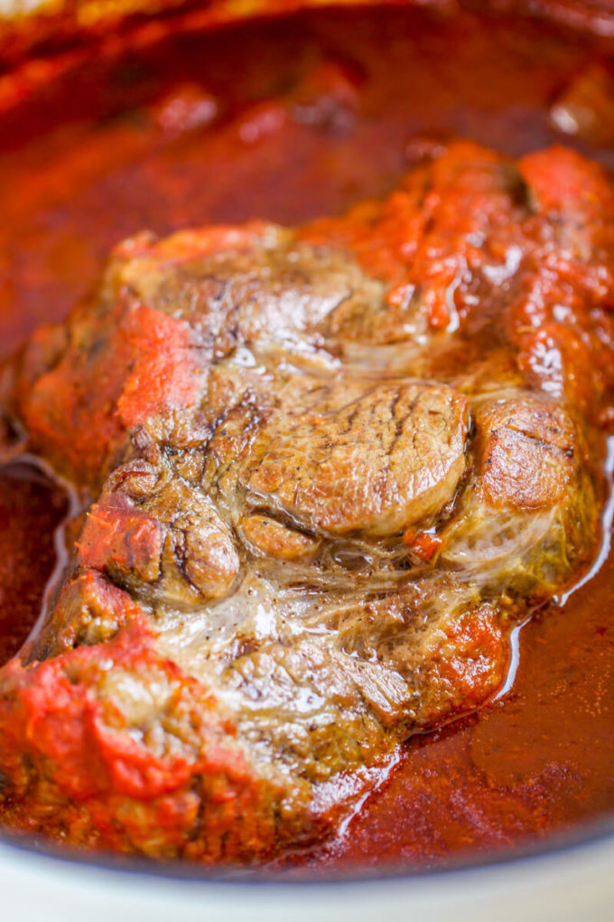 This Braised Tomato Chuck Roast is a decadent, but easy dinner - perfect for Sunday dinners!