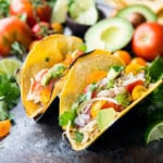 Honey Lime Chicken Tacos are cooked in the slow cooker, shredded, and used in tacos, burritos, nachos, etc. It is flavor packed and super delicious.