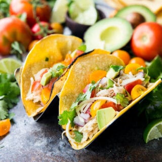 Honey Lime Chicken Tacos are cooked in the slow cooker, shredded, and used in tacos, burritos, nachos, etc. It is flavor packed and super delicious.