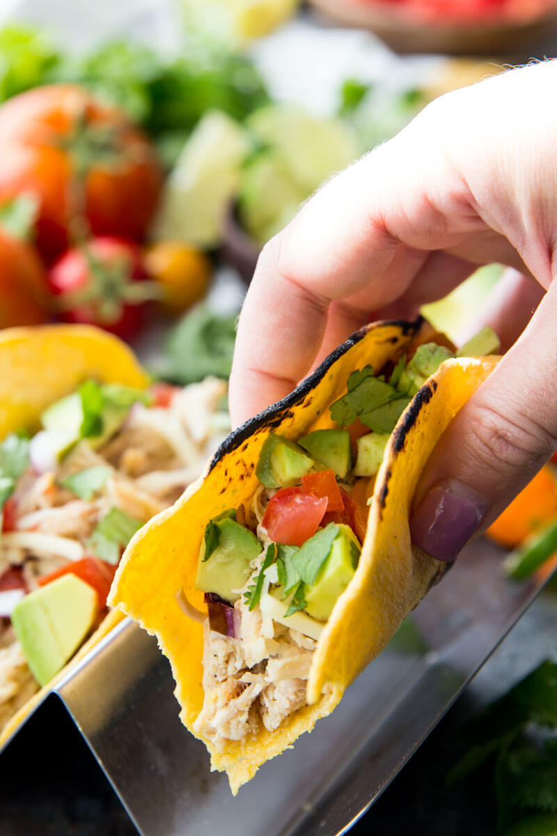 Slow Cooker Honey Lime Chicken Tacos are cooked in the slow cooker, shredded, and used in tacos, burritos, nachos, etc. It is flavor packed and super delicious. 