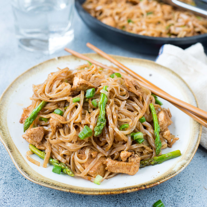 Chicken Stir Fry Rice Noodles is a quick stir fry recipe with bursting Asian flavors. All you will need is one pan and less than 30 minutes to make a delicious weeknight dinner. While Chicken and asparagus works as a wonderful combination, you add any vegetable of your choice.