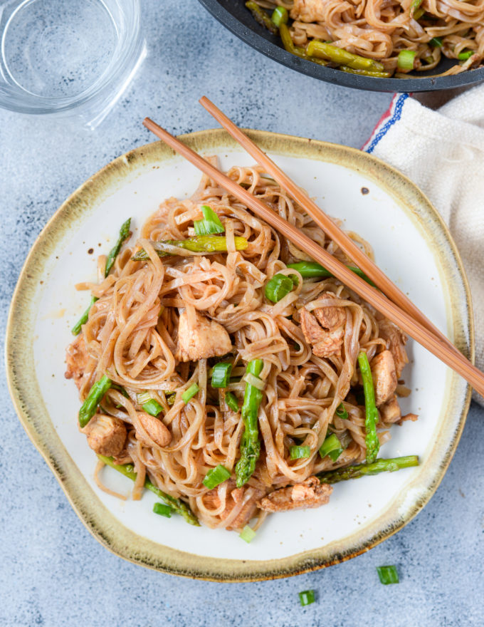 Chicken Asparagus Stir Fry Rice Noodles is a quick stir fry recipe with bursting Asian flavors. All you will need is one pan and less than 30 minutes to make a delicious weeknight dinner. While Chicken and asparagus works as a wonderful combination, you add any vegetable of your choice.