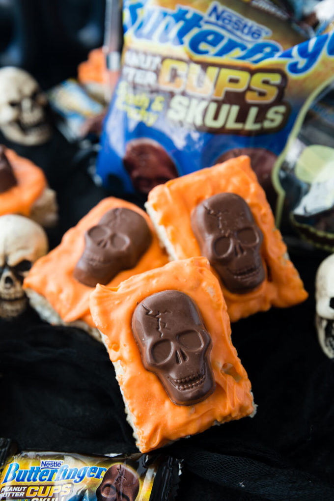 Tasty and festive Halloween Rice Krispie Treats with Butterfinger Peanut Butter Skulls