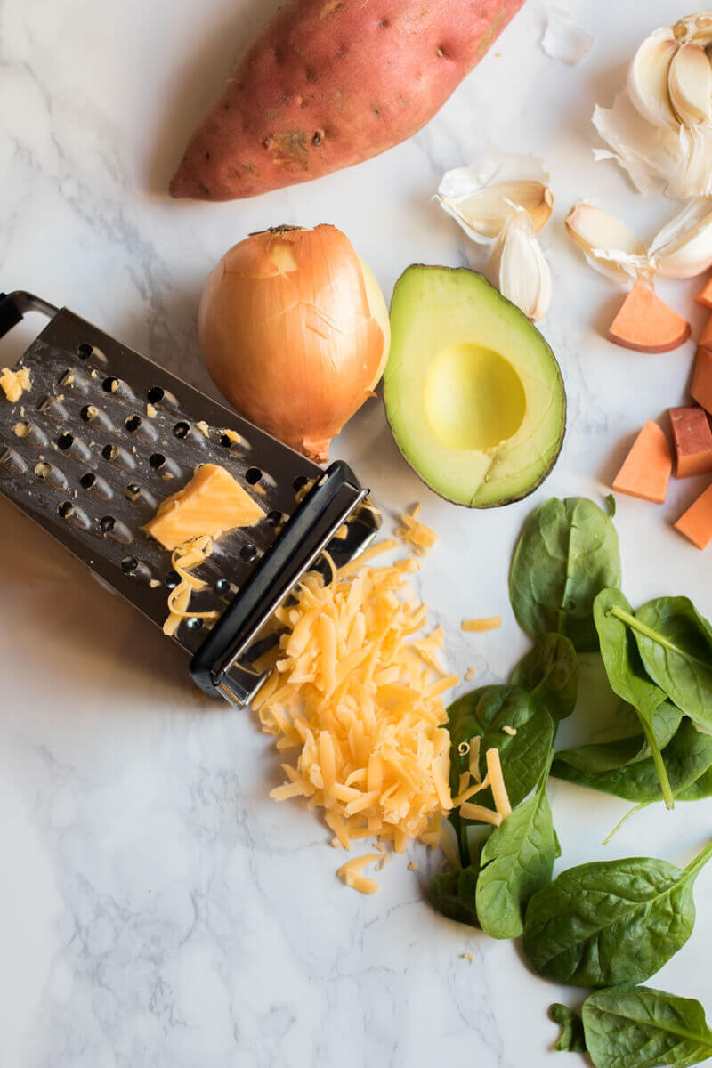 Southwestern sweet potato and ground beef skillet is loaded with fresh veggies and topped with cheese and avocado. A healthy, easy, and insanely delicious dinner that your whole family will love. Ready in 30 minutes!